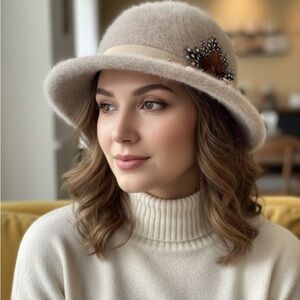 566A. Elegant beige angora Hat with Feather Accent